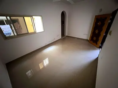 Studio in Al Rawda 2, spacious layout, separate kitchen, split AC, prime location.
