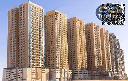One-bedroom apartment with a living room and furniture for sale in Paradise Tower, Emirates City, Ajman.