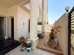 Luxury 5BR villa in Al Amra Ajman, hotel-style features, central AC, premium finishing.