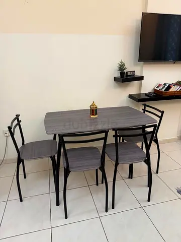 Compact 4-Seater Dining Table Set with Chairs - Grey Wood Finish. Only one month old.