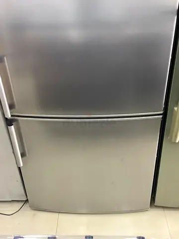 Stainless steel double-door refrigerator in good working condition
