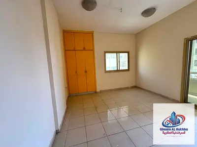 Near Corniche! Huge 1BR, sea view balcony, built-in wardrobes, central AC. Strategic spot with easy Dubai exit & flexible payments.