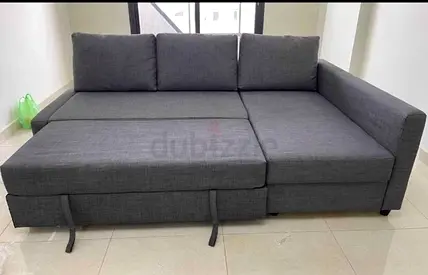Gray L-shaped Sofa Bed with Storage — Good Condition