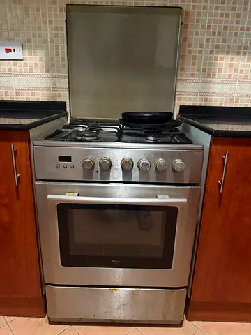 Used stainless steel 4-burner gas cooker with oven - Good Condition