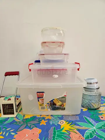 Assorted plastic storage containers, lids and kitchen accessories with French fry maker