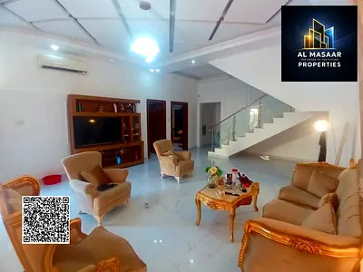 Modern villa for sale in Al Yasmin area – Ajman. The villa's facade is stone.