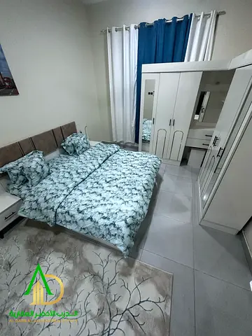 A furnished two-bedroom apartment with a living room is available for monthly rent in the Al Rawda 3 area of Ajman—an excellent opportunity for fami