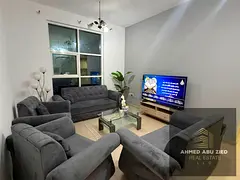 Two bedrooms, one of which is a master bedroom; a large, separate, fully furnished living room; a ba