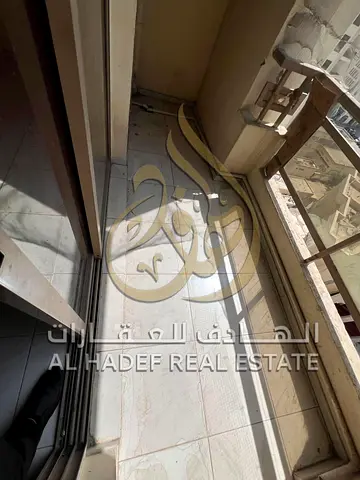 Two-bedroom apartment with a living room for annual rent – ​​Abu Shagara area – Contract explicitly
