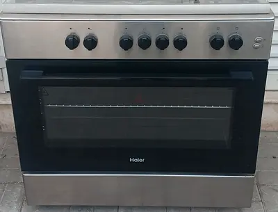 HAIER gas cooker with 5 burners, all working perfectly, and its size 90x60cm