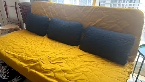 NYHAMN IKEA Yellow quilted futon sofa bed with cushions - good condition with extra bed sheets