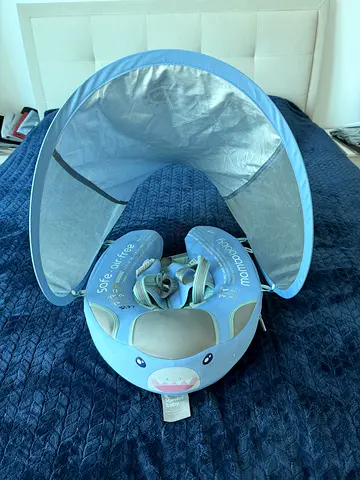 Very well used Mambobaby swimming float with canopy