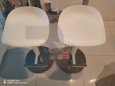 Pair of modern white bar stools with chrome base