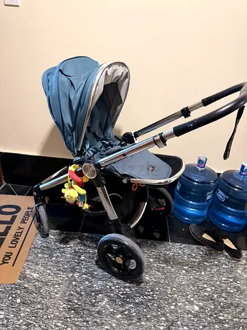 Mamas Papas Ocarro- all-terrain pushchair with a stunning metallic chassis and deep blue.