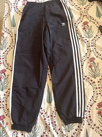 Adidas Originals black track pants with white stripes, size xs
