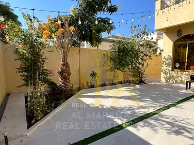 Villa for sale in Al Rawda 1, Ajman, with 5 master bedrooms, including electricity and water fees. Located on the main street, this villa is ready to