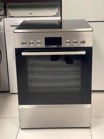 Bosch Series 6 freestanding electric cooker featuring a stainless steel finish and a glass-ceramic h