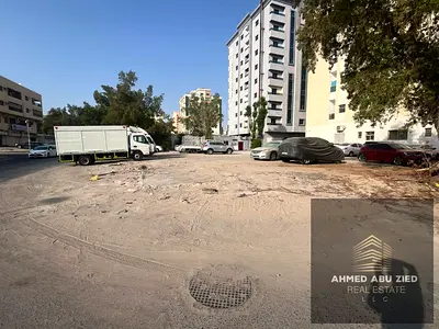 Corner plot on two streets with service lane for sale in Al Rashidiya 3 Ajman residential commercial land G+10 floors 6400 sqft investment opportunity