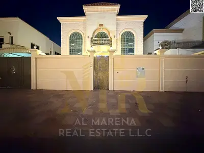 Luxury villa for sale in Al Muwaihat 2, 6 master bedrooms, price includes electricity, water, and air conditioning. Freehold ownership.