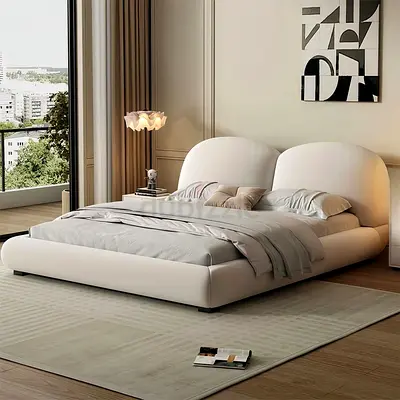 Modern low-profile upholstered double bed with rounded headboard - beige