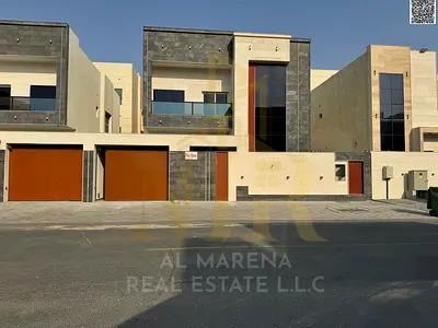 Luxury villa for sale in Al Amrah area - Ajman | Central air conditioning, modern design and luxurious specifications. Take advantage of the opportuni
