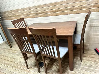 Solid Wood 4-Seater Dining Table with Cushioned Chairs - Good Condition