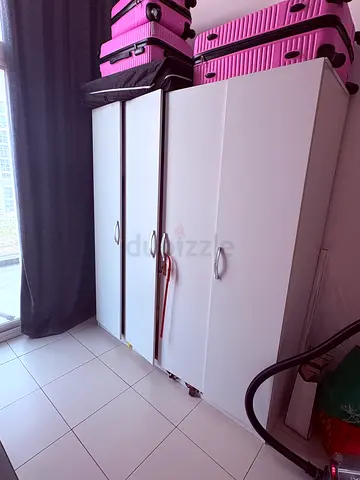 White 4-door wardrobe / storage cabinet in good condition