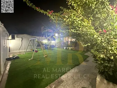 Villa in Al Rawda 1 area, corner plot on two streets, central air conditioning, 5 master bedrooms, facing a mosque, modern design, close to all servic