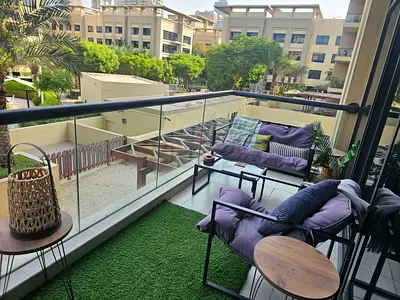 Cozy Outdoor Balcony Seating Set with Cushions and Side Tables