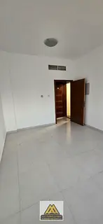 Studio for annual rent in Al Nuaimiya 2, Ajman. Spacious area, semi-separated kitchen, central AC, f