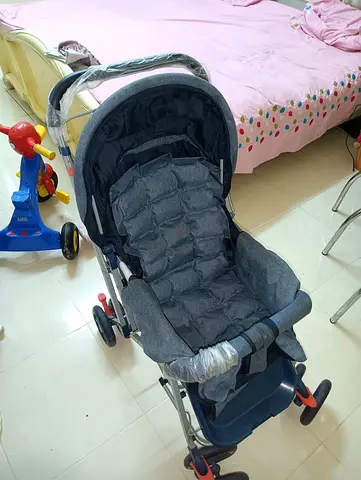 Lightweight grey baby stroller in good condition