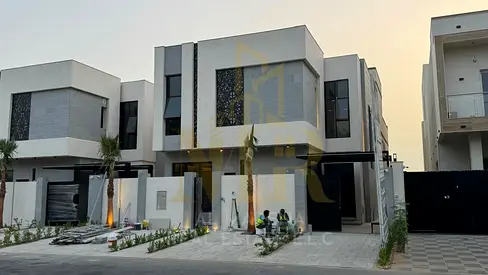 Luxury villa for sale in Al Zahia, Ajman, on Emirates Road exit, including electricity, water, and air conditioning, at a special price.