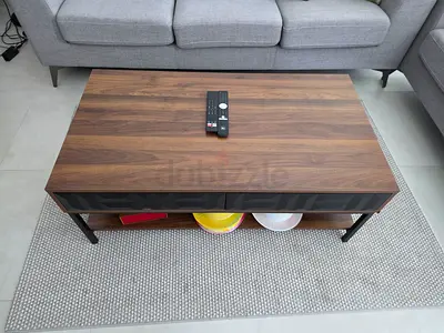 Wooden coffee table with lower shelf — good condition