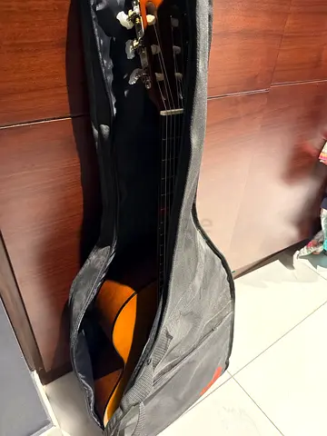 Yamaha classical acoustic nylon-string guitar with soft case