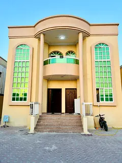 For rent in Al Rawda 2, Ajman: A villa featuring 5 bedrooms, a majlis, a living area, a spacious kit