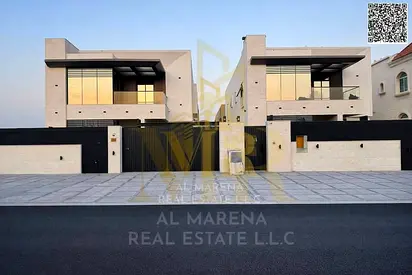 Two-story villa with a rooftop terrace, freehold, in one of Ajman's most prestigious areas, on a main street. Price includes electricity, water, and a