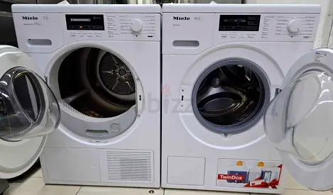 Miele W1 TwinDos washing machine and a matching Miele T1 SteamFinish dryer in a side-by-side configu