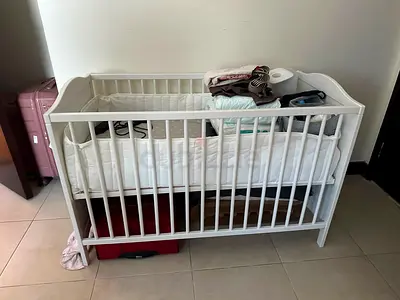White wooden baby cot / crib in good condition