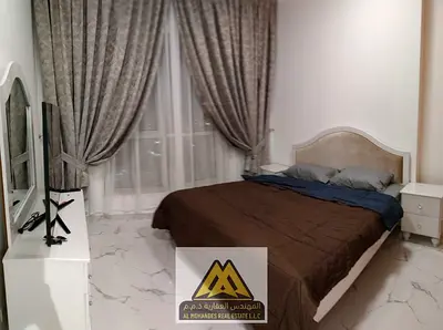 For sale: Two bedrooms and a living room in Al Waha Towers Al Rashidiya1, with gym, swimming pool, and parking, close to all services and main roads