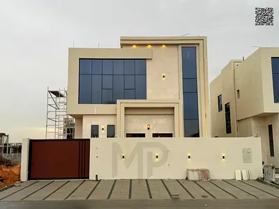 Elegant villa for sale in Al Helio 2 – Ajman. A villa with a sophisticated modern design consisting of 5 master bedrooms and two floors, with well-pla