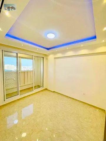 For annual rent in Ajman a three-bedroom apartment with a living room in Al Rawda 3 featuring a spacious layout elegant design and a prime location