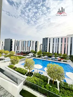 Sharjah, Aljada Compound: One bedroom, living room, kitchen, and bathroom.