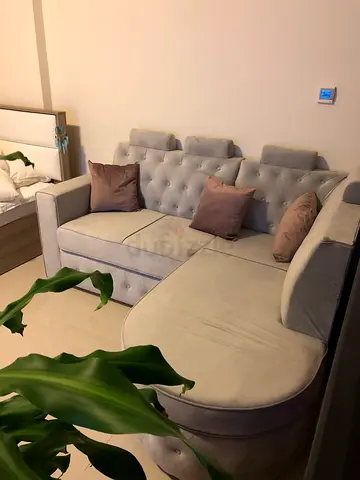 Light grey tufted sectional sofa with chaise with pillows  350aed take all
