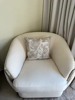 Elegant Cream Armchair with Decorative Leaf Carving