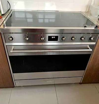 Smeg 90cm freestanding induction cooker, likely model C9IMX2 or a similar Classica series unit, feat