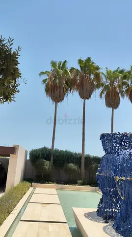 Outdoor garden with pool and decorative sculpture