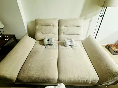 Light beige 2-seater sofa bed — good condition