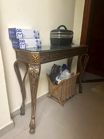Ornate gold console table with woven lower shelf - good used condition
