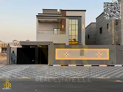 Luxury villa for sale in Al Rawda 2 - Ajman on Sheikh Ammar Street, area 4300 square feet, two floors + roof | 5 master bedrooms, a majlis and two hal