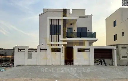 A distinctive villa in Al Zahia area, two floors and a roof, with a price including electricity, water and air conditioning fees, on the main street,